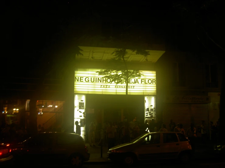 a large theater sign on the side of a building