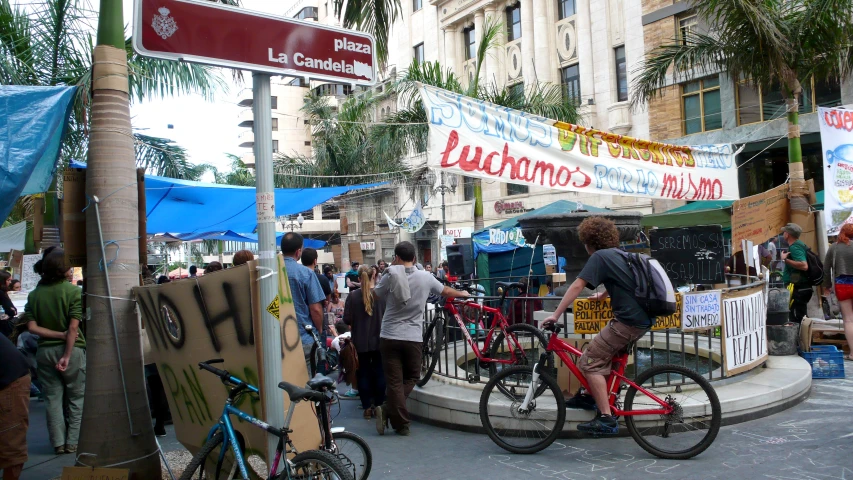 a bunch of people with bikes on the street