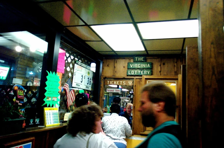 a man and woman inside of a booth at an event