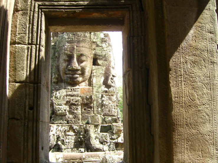 the interior of a doorway to a stone carved shrine