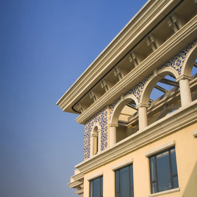 an ornately patterned building against a blue sky