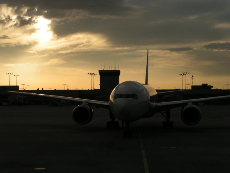 an airplane that is on a runway at dusk