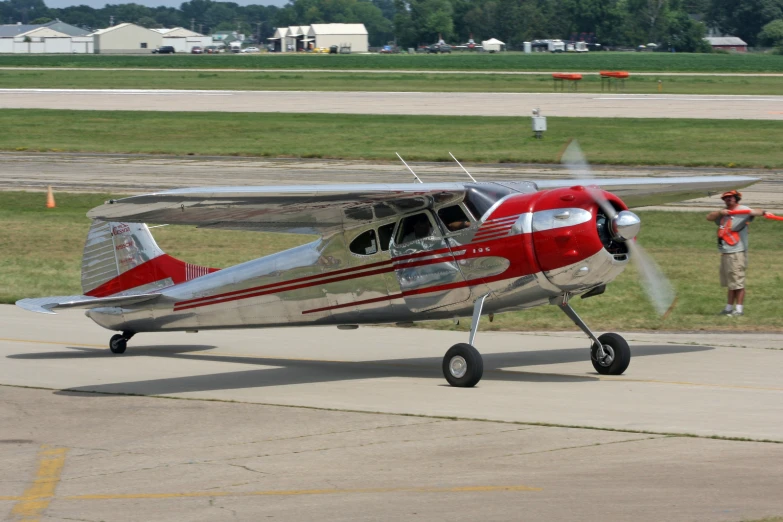 a single propeller plane is on the runway