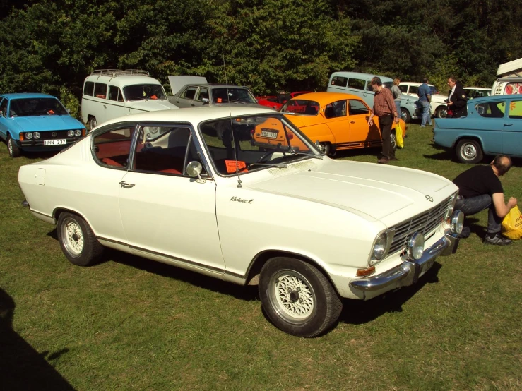 there is some old cars parked at the show