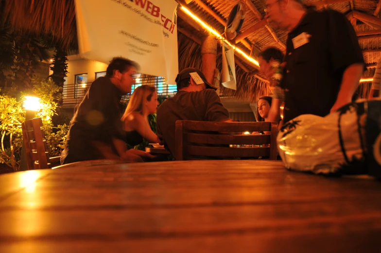 a group of people sitting around a table