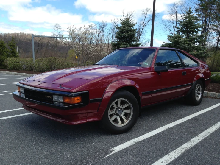 a red car parked in a parking lot