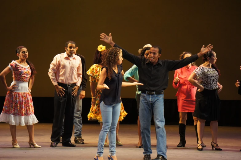 a group of people standing on top of a stage