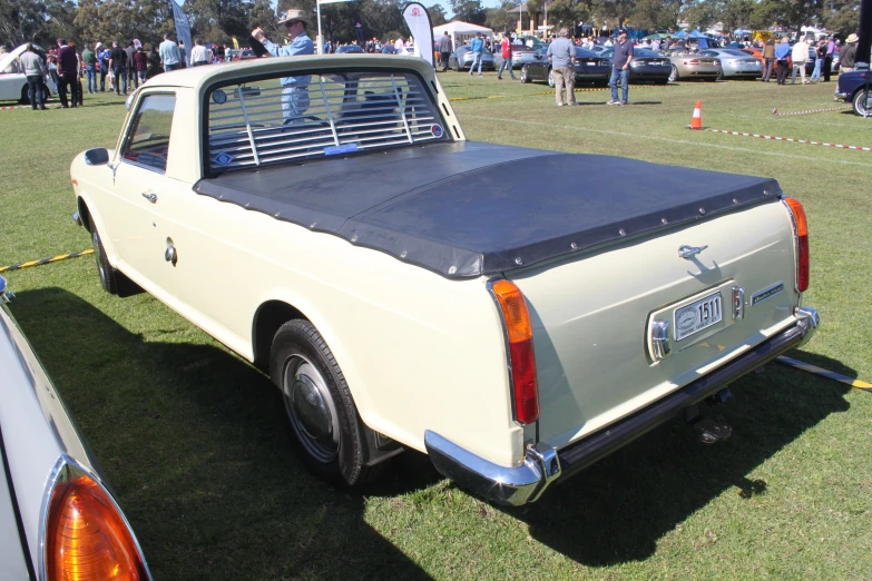 a close up of a car on a grass field