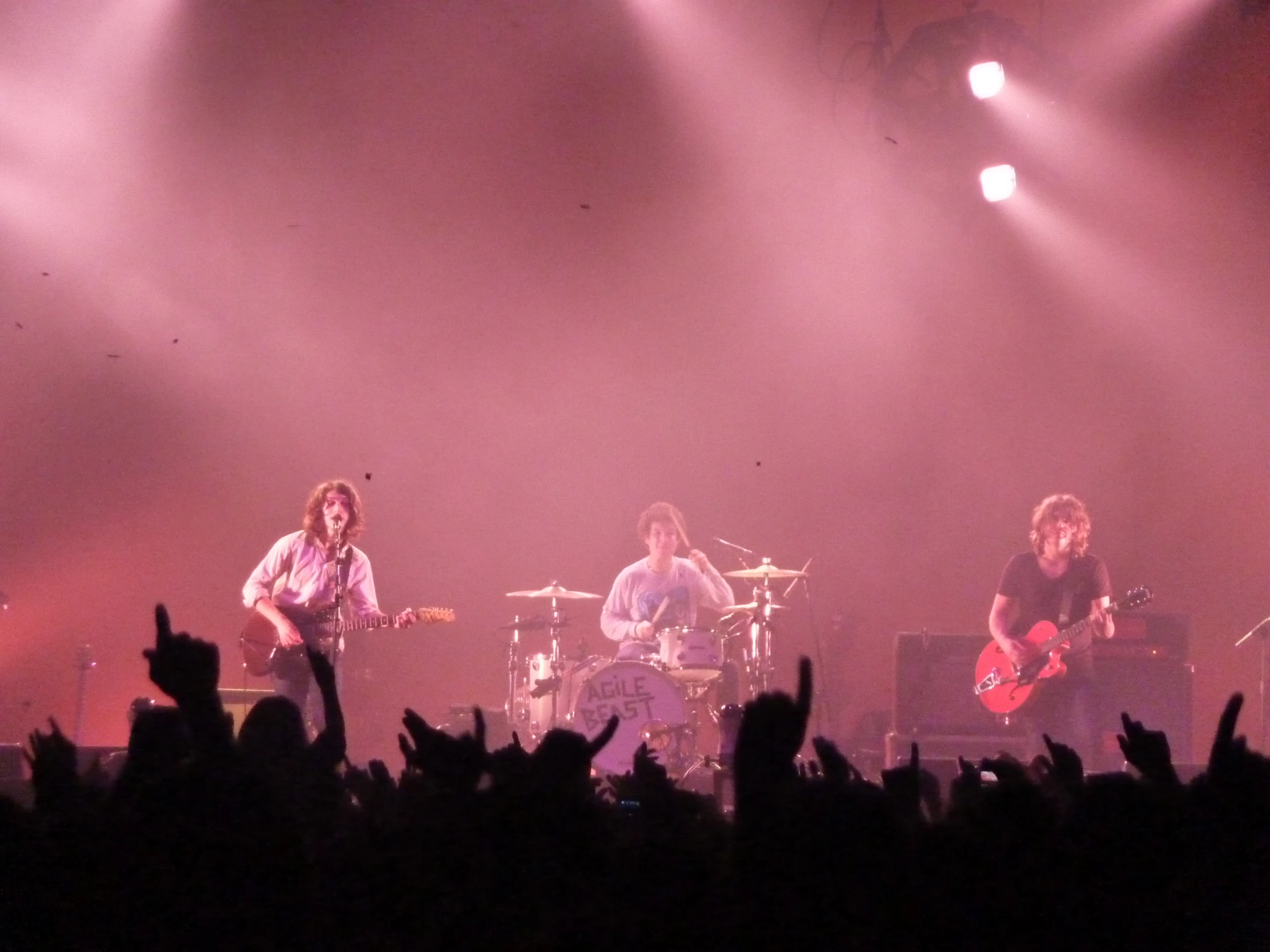 a concert scene with an over head view of musicians and a band performing