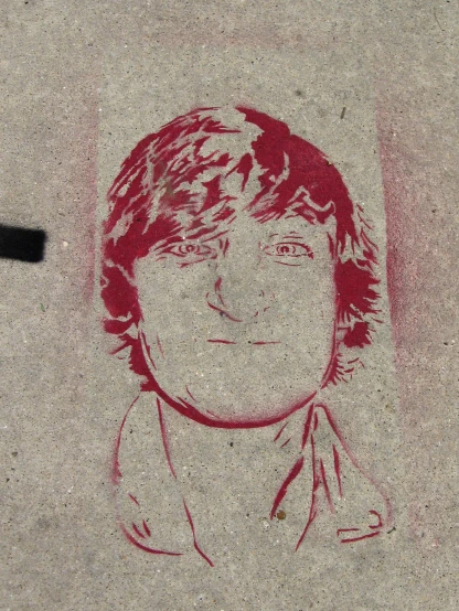 a person that is standing in the sand with a drawing of him