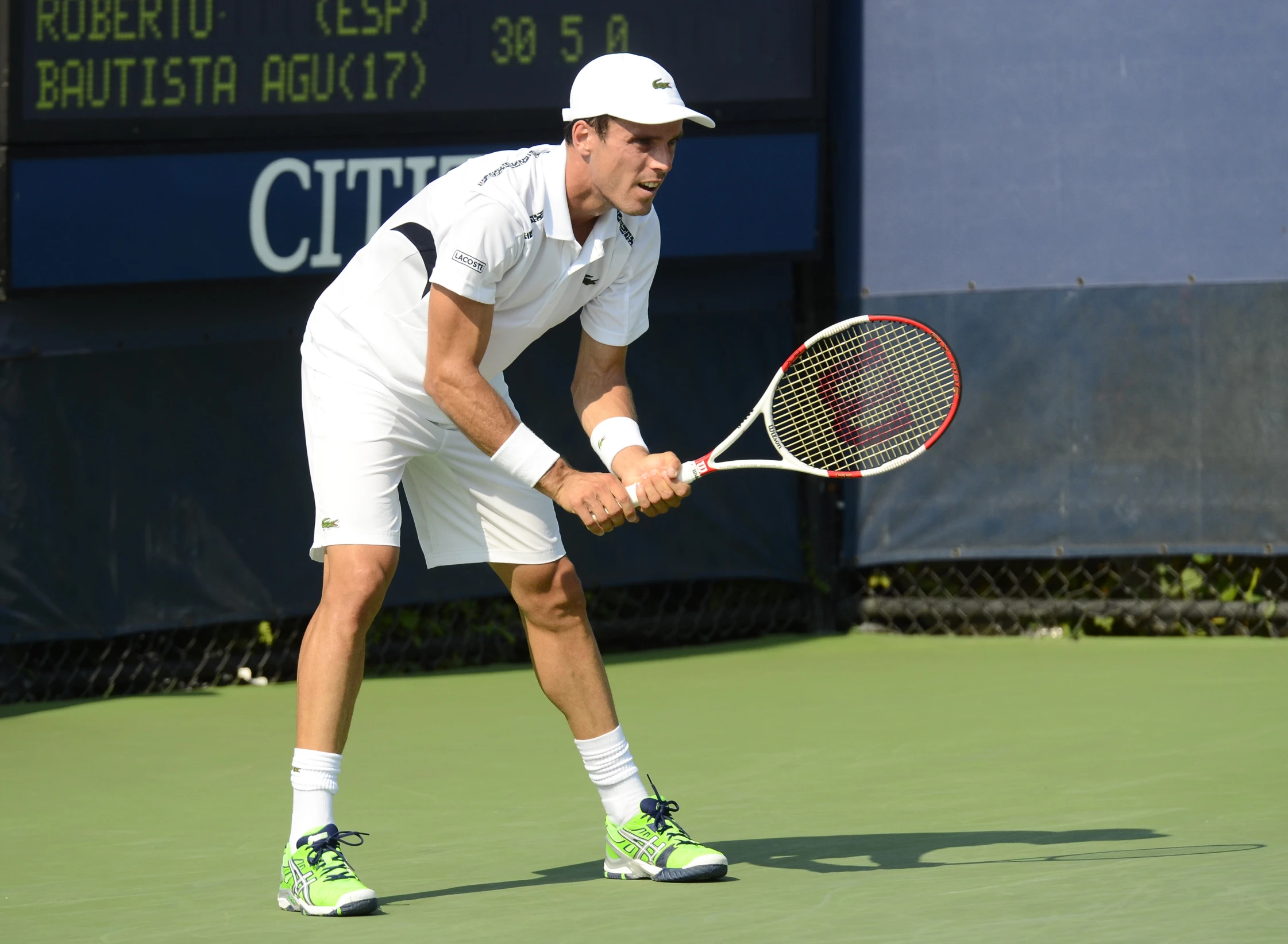 a tennis player getting ready to hit the ball