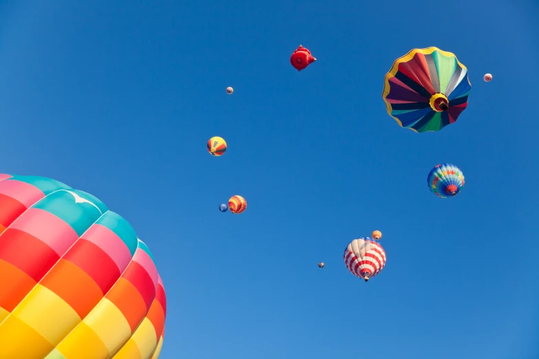 colorful air balloons are flying in the sky