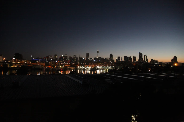 a city skyline is seen at night in the background