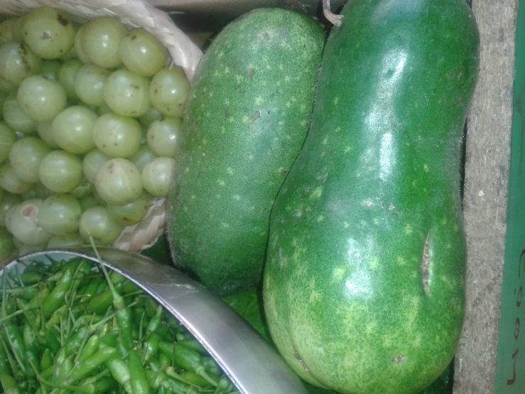 cucumbers and gs stacked next to one another