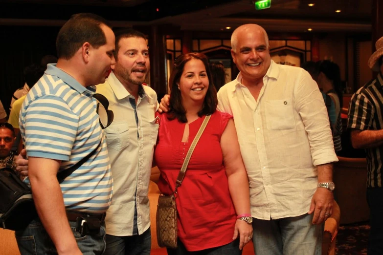 a group of people are smiling with each other