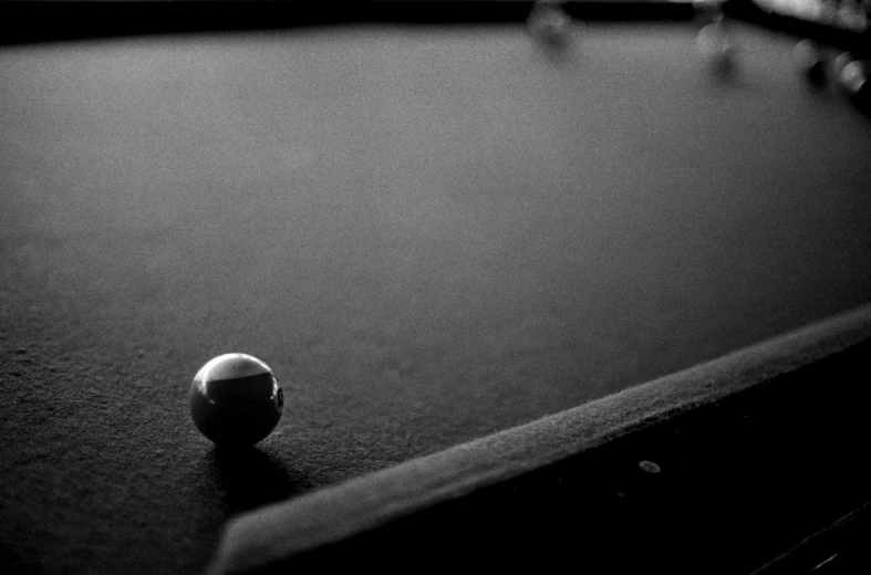 a black and white po of a pool table