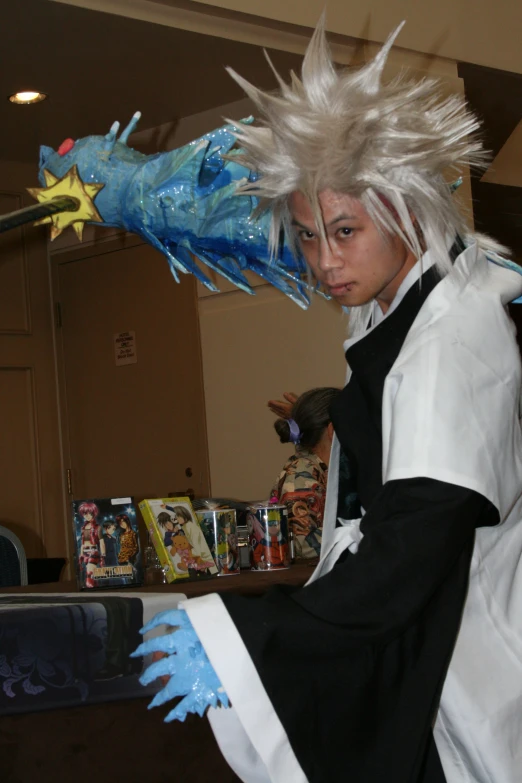an anime character with white hair and blue gloves, in costume