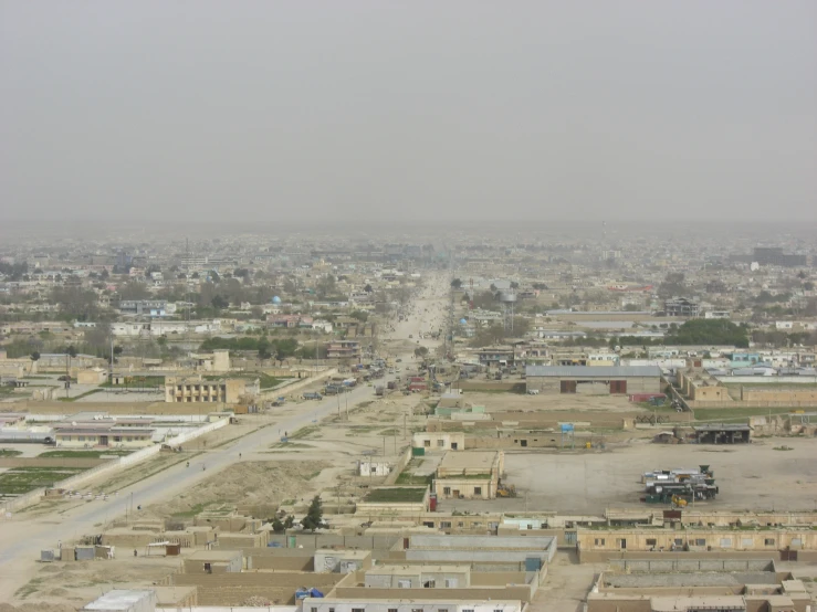 an aerial view of a city with buildings in the background