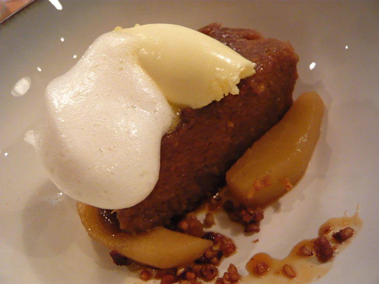 closeup of a dessert with ice cream and fruit