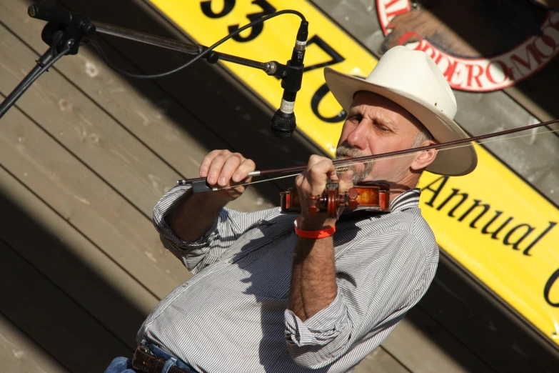 the man is playing music at the event