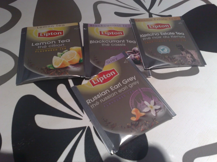 four pack of lipton tea bags sitting on a table