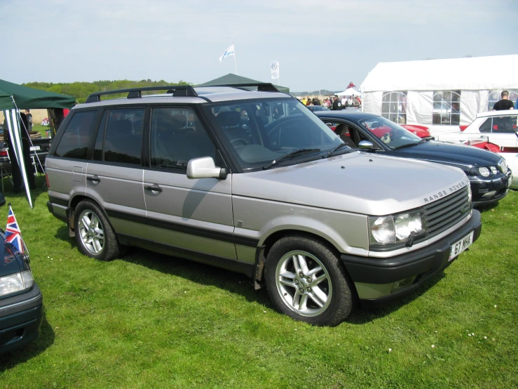 a range rover suv parked on the grass