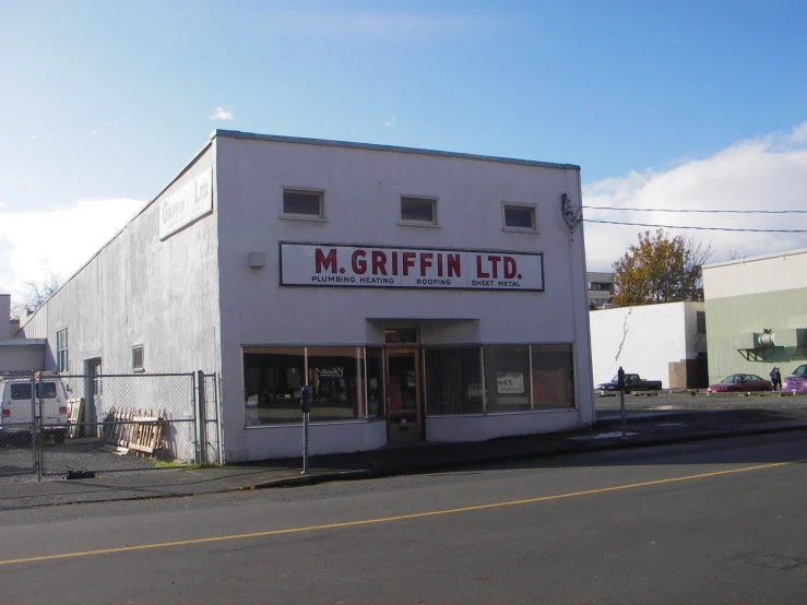 a building with a sign saying m griffin ltd