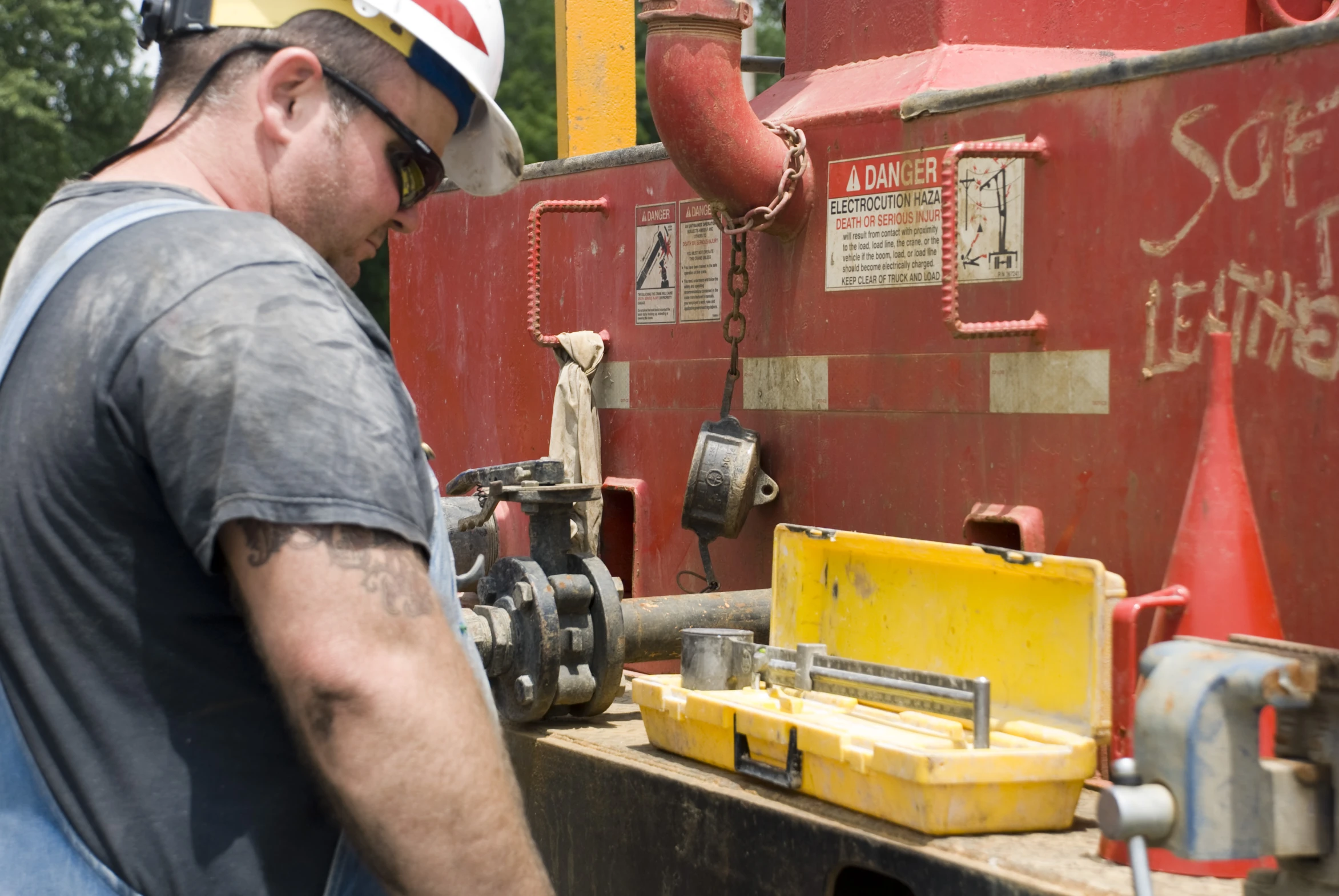 a man who is operating an oiling machine