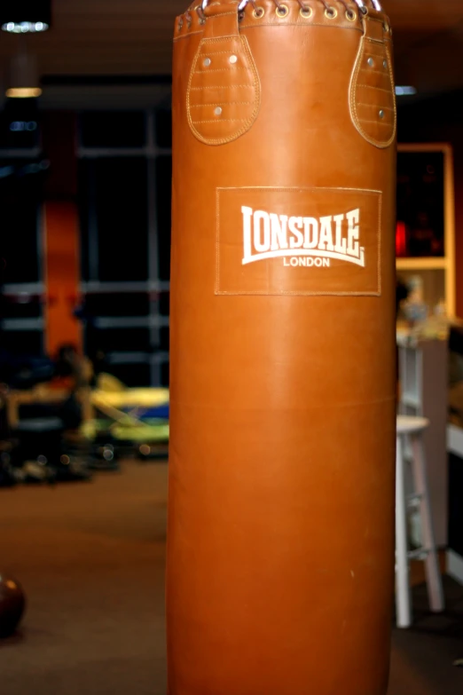 a tan boxing bag sitting in a building