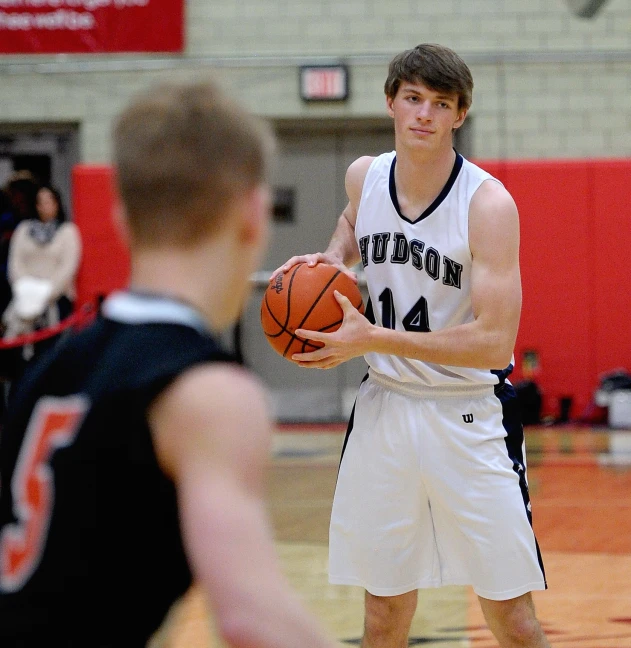 a basketball player holding the ball during a game