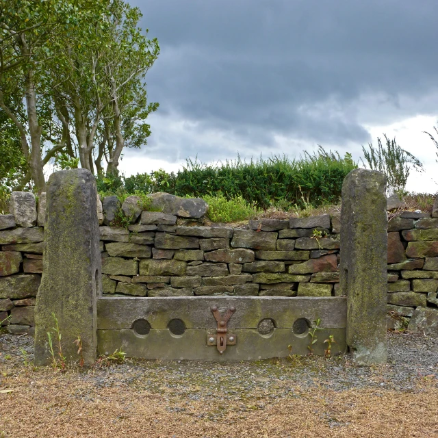 a couple of old cement posts with a red fire hydrant