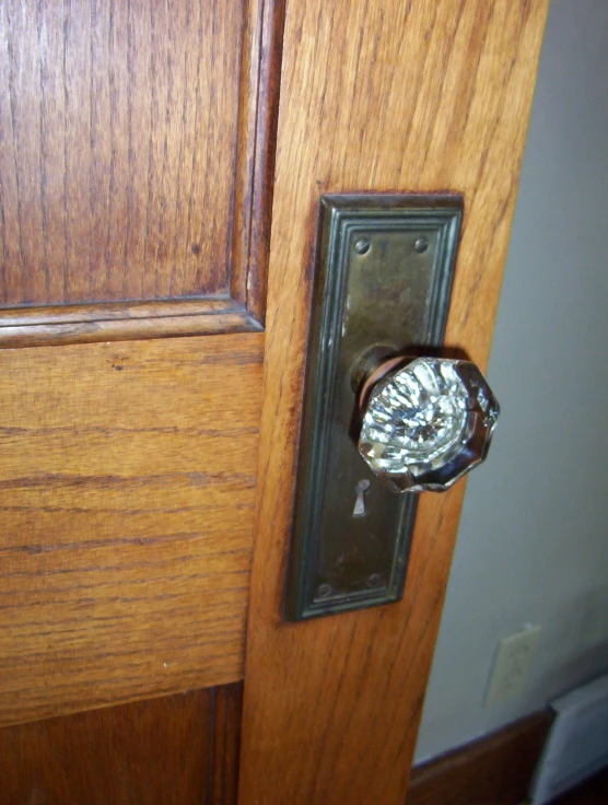 a metal object is embedded in a wood door