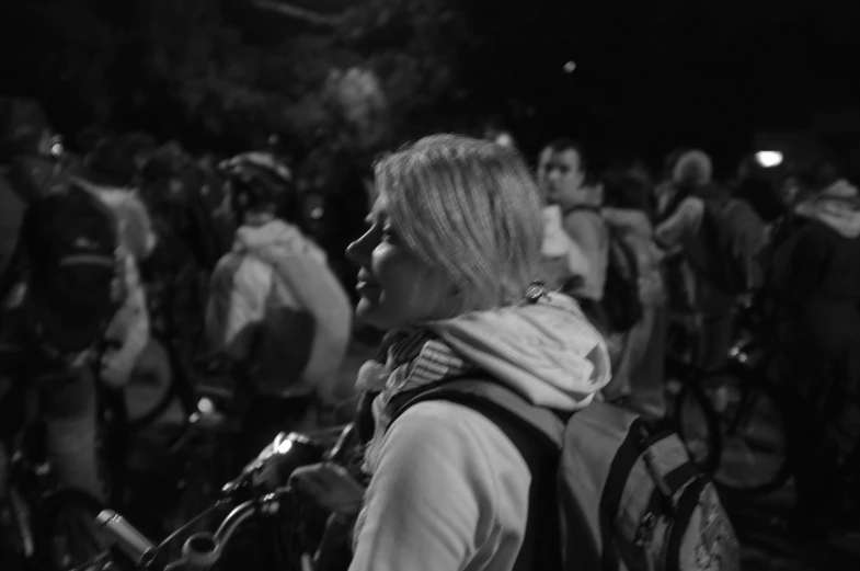 a black and white pograph of a crowded street