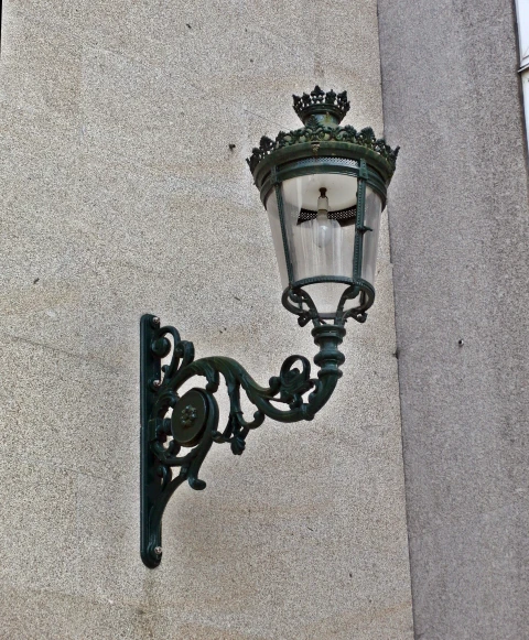 a lamp hanging off the side of a wall