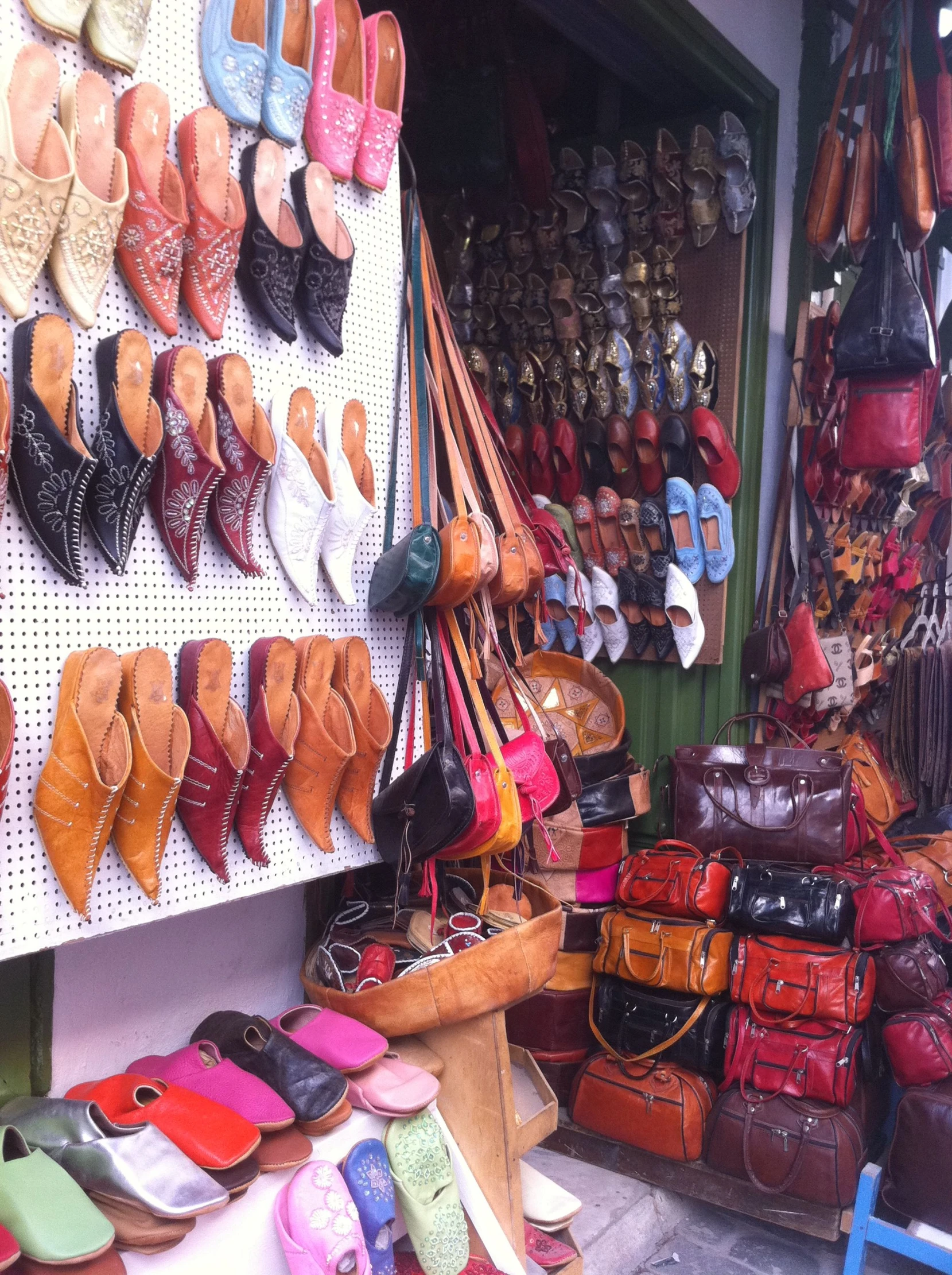 the shoe shop is full of lots of shoes for sale