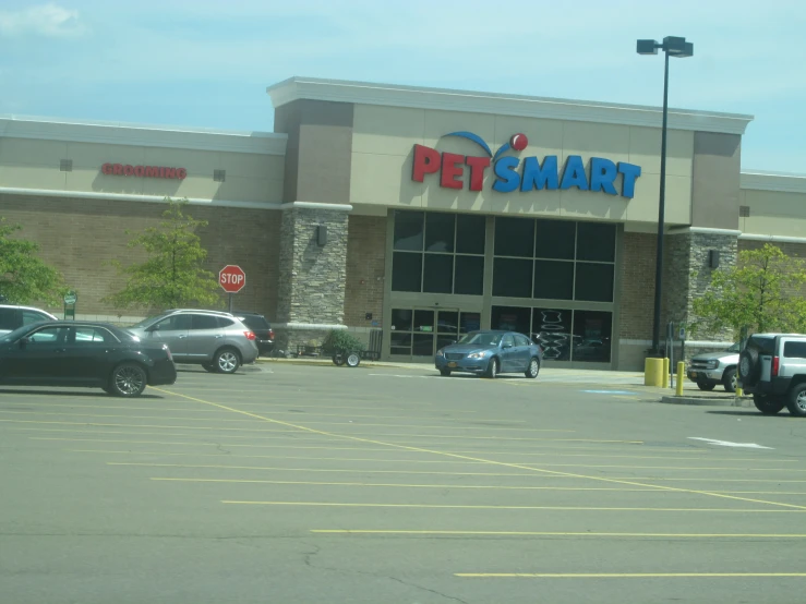 a store that has several cars parked in the lot