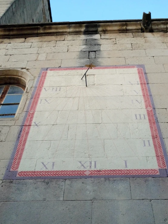 an image of a large clock on the side of a building