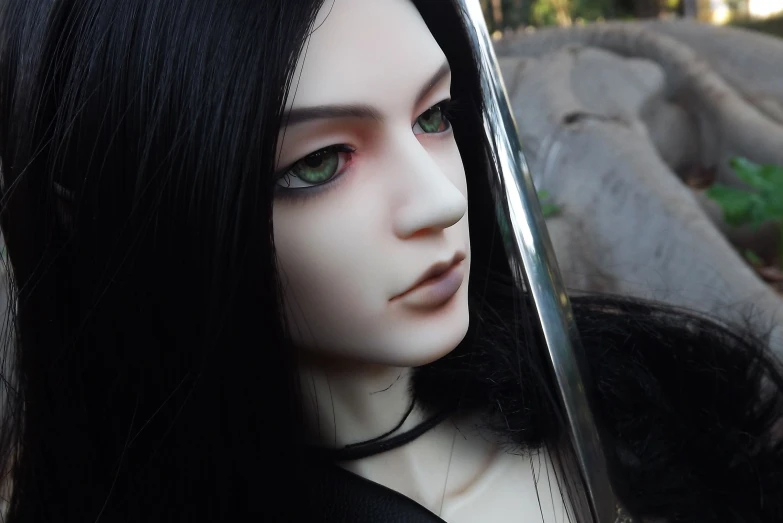 a black - haired mannequin with a sword and hair