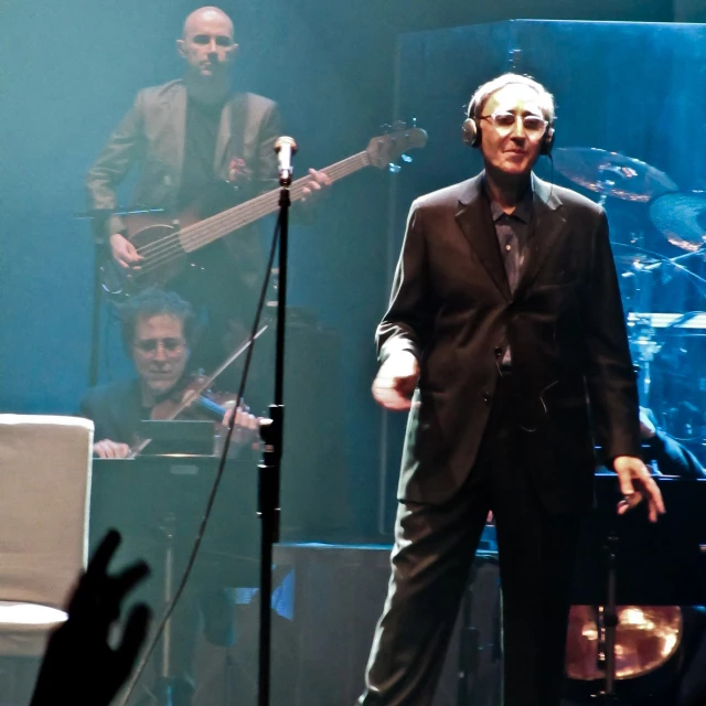 a man that is on stage with a guitar