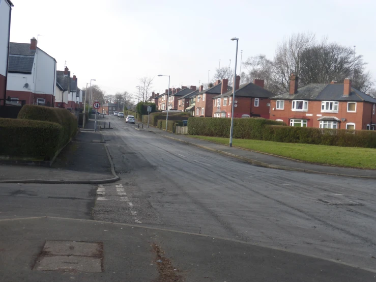 some houses are on the opposite side of a street