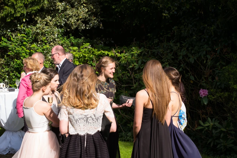 a group of s standing in front of a table