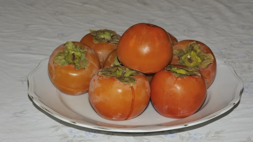 a large white platter topped with fresh tomatoes