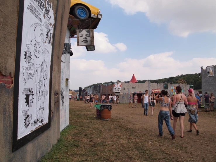 many people are gathered together in the mud on a field