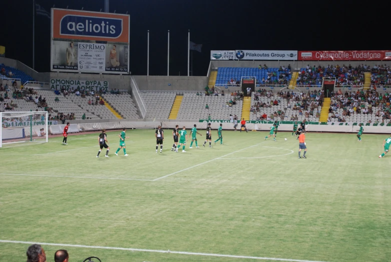 a group of people on a field playing soccer