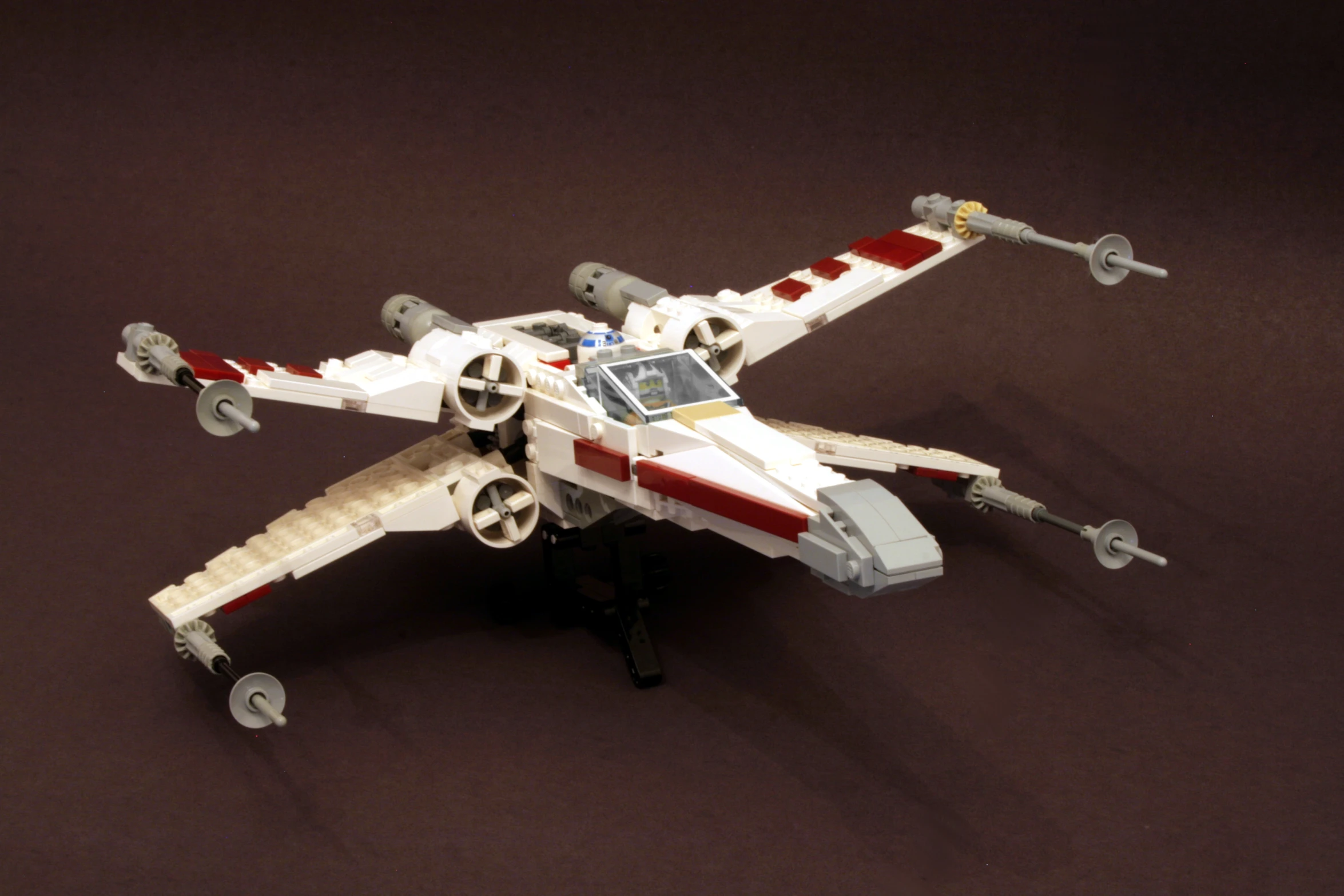 a lego style star wars fighter jet with weapons