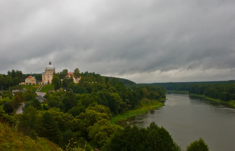 a view of the river and a castle with a bell tower near it