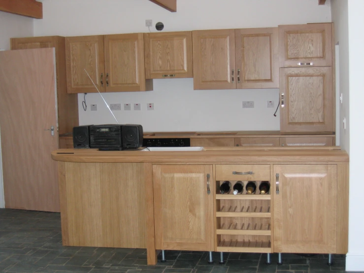 a kitchen with some cupboards and appliances