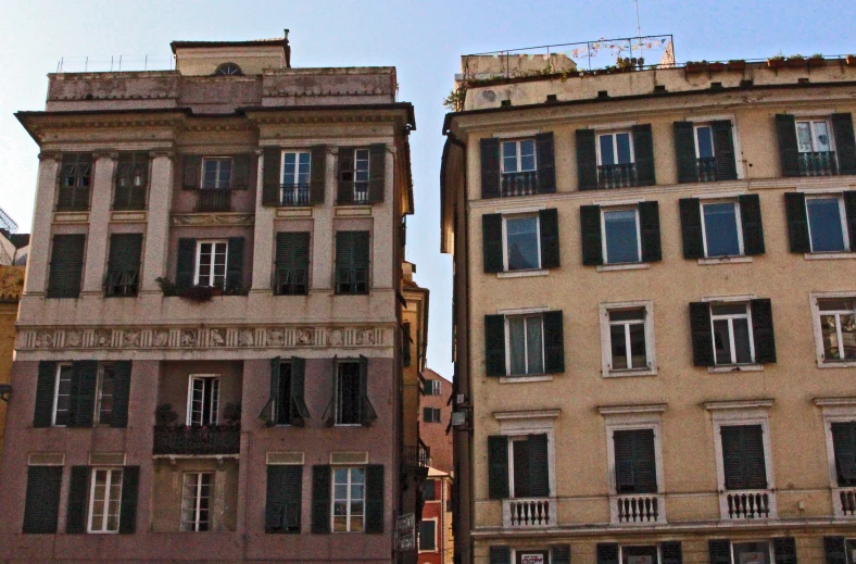 the top floor of a building has closed shutters