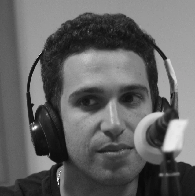 a man wearing headphones and holding a video game controller