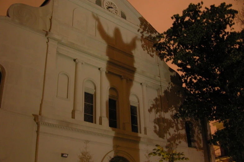 shadow cast on the side of a large building